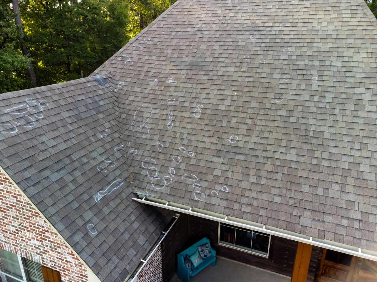 Residential roof showing multiple impact points caused by Hail during a severe storm
