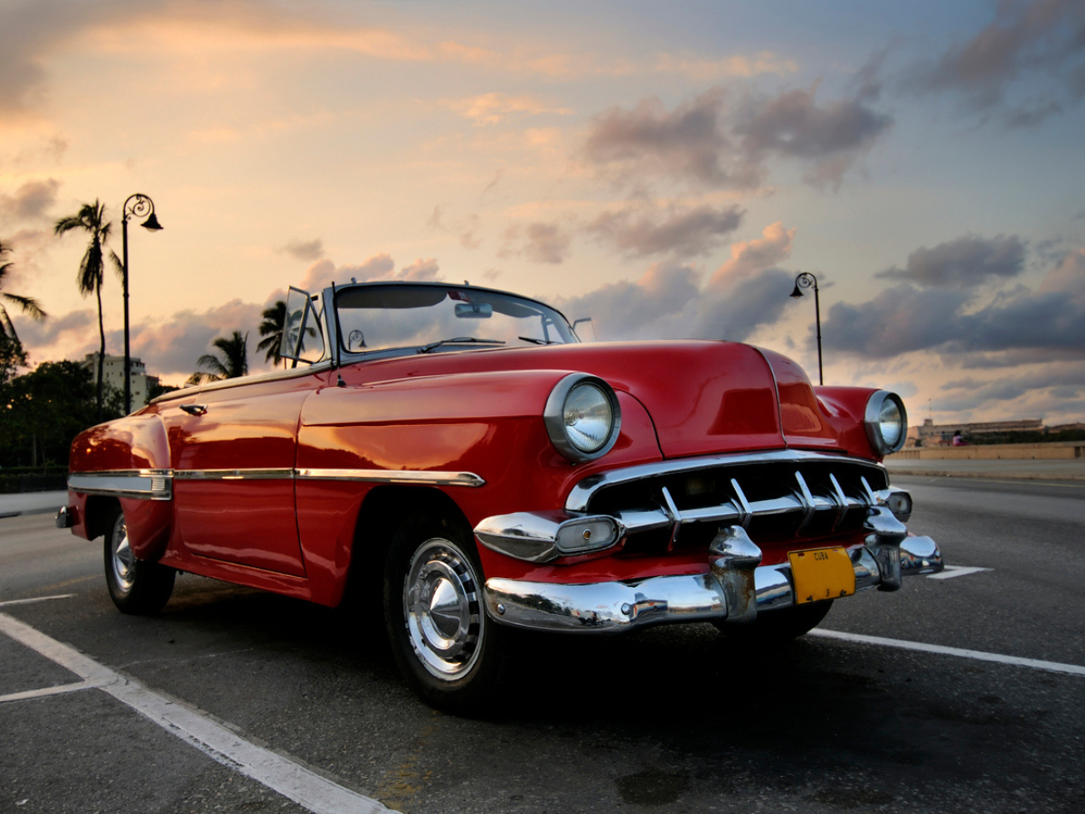 classic car in a beautiful sunset with sandbox classic car insurance