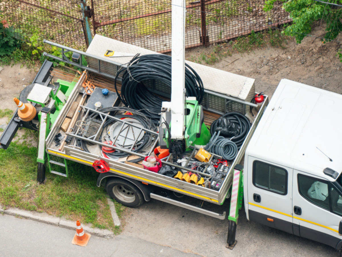 Commercial vehicle hauling contractor tools and materials, illustrating the need for equipment and commercial auto insurance in Western Canada