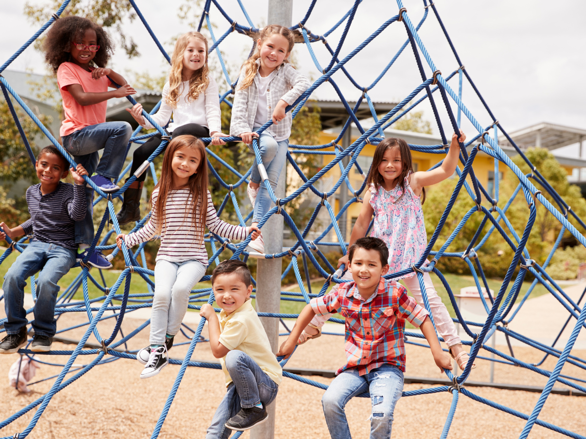 kids with sandbox insurance playing on playground