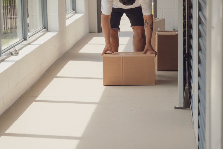 Man moving into a condo with condo insurance with Sandbox