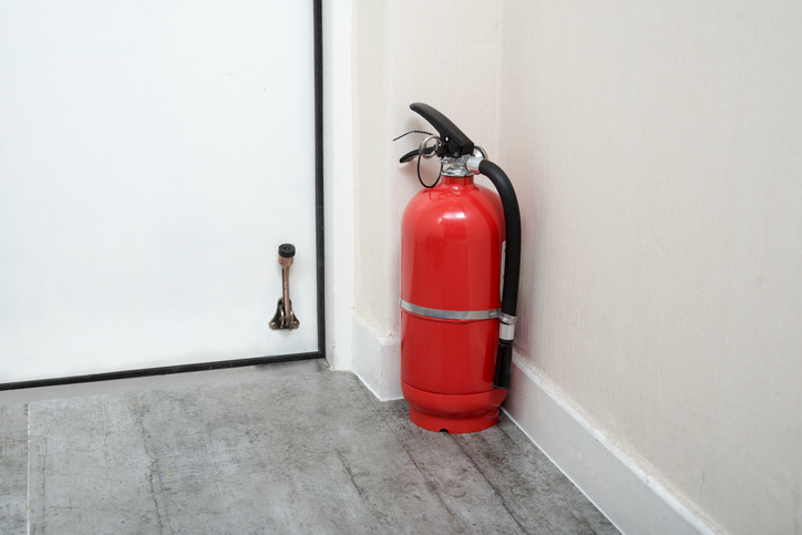 Fire extinguisher sitting on a cabin flood