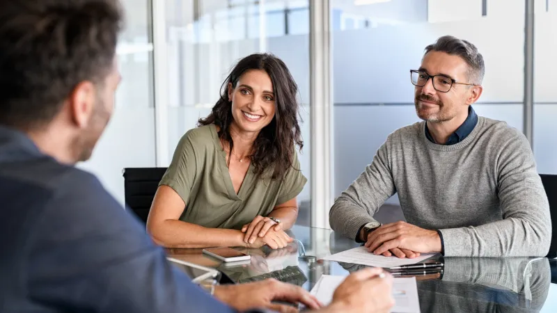people talking to their sandbox broker about updating their home insurance policy