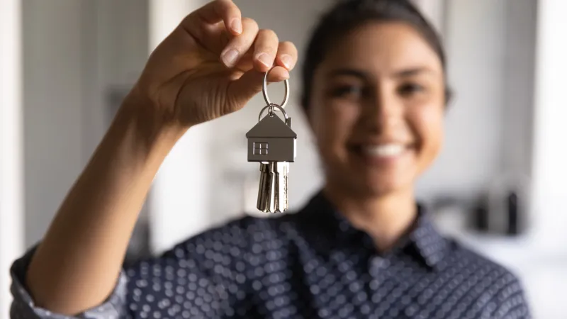 Happy woman ready to move into new home
